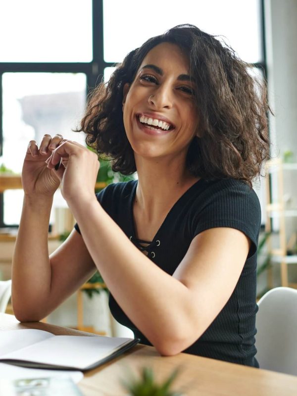 happiness-and-inspiration-overjoyed-multiracial-coach-sitting-with-pen-and-looking-at-camera.jpg happiness-and-inspiration-overjoyed-multiracial-coach-sitting-with-pen-and-looking-at-camera.jpg